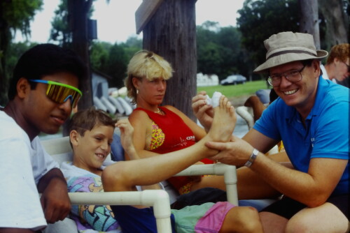 Steve Slusser RN wraps a toe during a game. Also shown are Kim Carter and Conrad Campbell